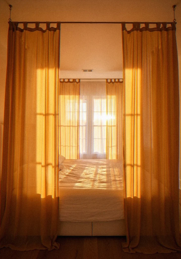 Yellow Canopy Bed with Sheer Drapes
