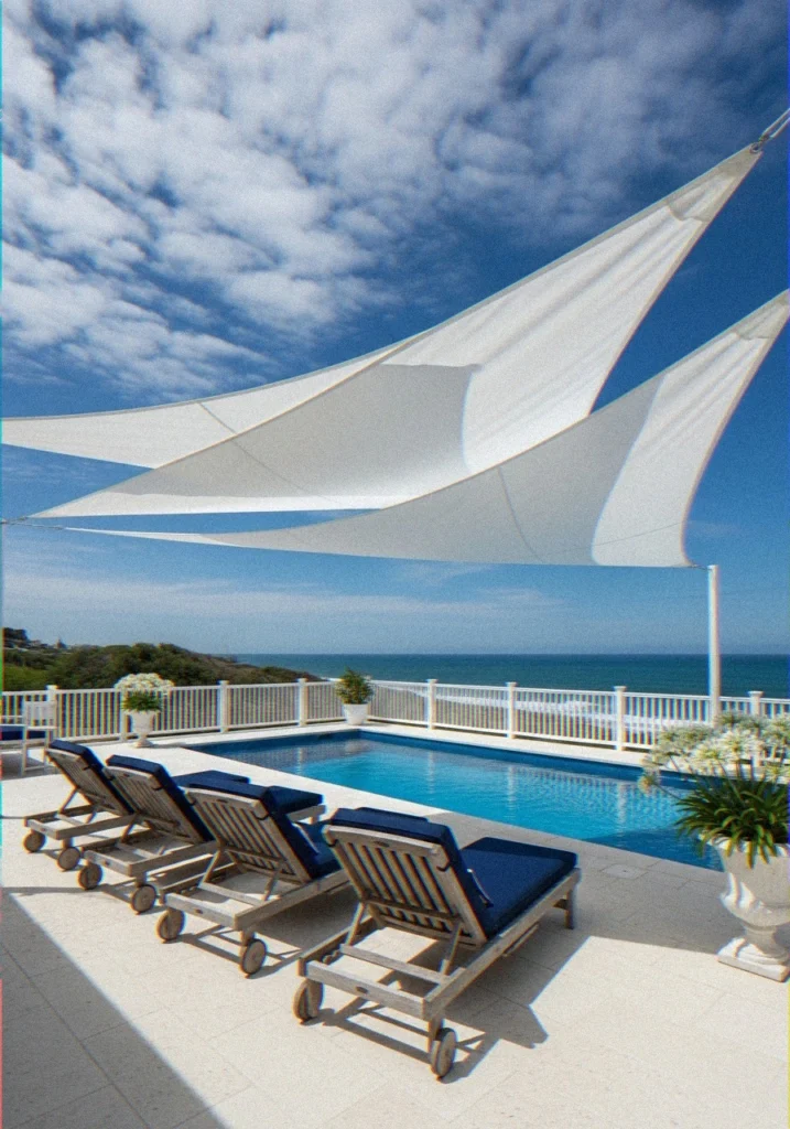 White Sail Shade Stretched Over Coastal Pool